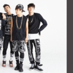 Promotional image for the blog article on Bangtan Now about "2 COOL 4 SKOOL", BTS’s debut album. The photo features all seven BTS members during the official photoshoot, dressed in black-and-white hip-hop streetwear with bold patterns. On the right side, the title “INTRO: 2 COOL 4 SKOOL (FEAT. DJ FRIZ)” appears on a dark background with the Bangtan Now logo, representing the blog’s coverage of BTS lyrics and concepts.