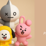 Imagem ilustrativa do artigo do blog Bangtan Now sobre o BTS BT21. Mostra todos os personagens do BTS BT21 em estilo 3D colorido: RJ, Koya, Mang, Shooky, Tata, Chimmy, Cooky e Van, organizados em um fundo bege. À direita, há o título do artigo com os dizeres “BTS BT21 – Conheça o mundo divertido e emocionante dos personagens criados pelo BTS”, acompanhado do logotipo do Bangtan Now.