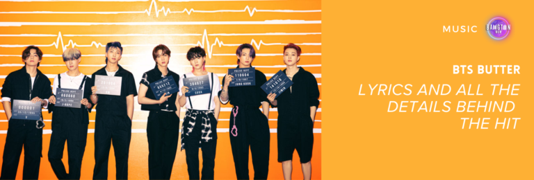 Cover image for the article “BTS Butter: Lyrics and All the Details Behind the Hit” on Bangtan Now. The photo features all seven BTS members standing side by side in front of an orange wall with a heartbeat line design. Each member is wearing a black outfit and holding a police-style placard with numbers. From left to right: the first member holds a sign reading “000001”; the second’s reads “660660”; the third, “201904”; the fourth, “655212”; the fifth, “384627”; the sixth, “110604”; and the seventh, “141018”. On the right side of the image, set on a solid orange background, the text reads: “BTS BUTTER – Lyrics and All the Details Behind the Hit” along with the Bangtan Now logo.