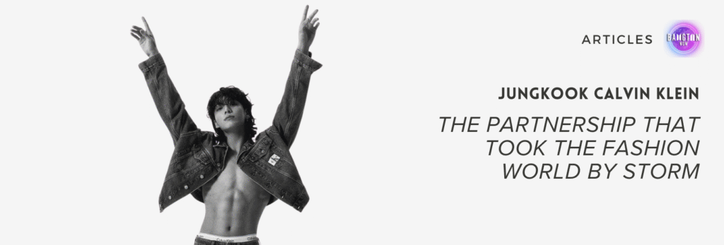Black and white promotional image showing Jungkook from BTS, shirtless and wearing an unbuttoned Calvin Klein denim jacket and jeans. He stands confidently with both arms raised high in a V-shape, looking straight ahead with a calm, assertive expression. His toned abs are visible, and the Calvin Klein logo can be seen on the waistband of his underwear and on the jacket pocket. To the right, the image features the article title in bold text: “Jungkook Calvin Klein – The Partnership That Took the Fashion World by Storm,” along with the Bangtan Now logo, signaling the article’s publication source.