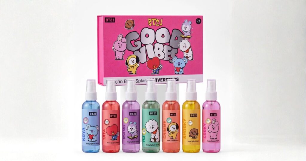 Cia Beauty body splash collection in collaboration with BT21, an official product from the BTS mascots line: pink 'BT21 Good Vibes Universtars' box in the background and seven colorful bottles lined up in front, each labeled with a character name — Koya, Tata, Mang, RJ, Chimmy, Shooky, and Cooky.