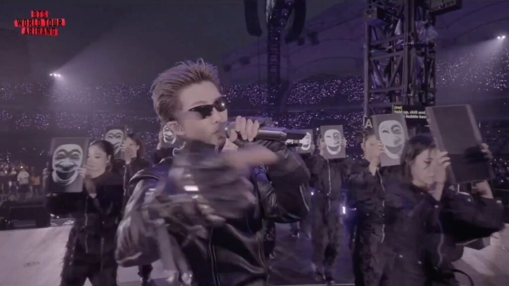 Traditional Korean hahoe masks on the screens during they don't know 'bout us
