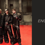 Cover banner for the article on Hooligan BTS lyrics. On the left, the seven BTS members in the Hooligan photo sketch, released on Weverse, pose side by side on a glossy red floor, in a gray concrete industrial warehouse with tall columns and spotlights in the background. They all wear black leather looks, with jackets, wide-leg pants, heavy boots, silver chains, and printed scarves around their necks; one flashes a peace sign and another wears sunglasses and a jacket with a fur collar. On the right, against a dark gray background, are the Bangtan Now logo, the word "Articles", and the text: "Hooligan Lyrics: English translation, pronunciation, meaning, and fun facts you never imagined."