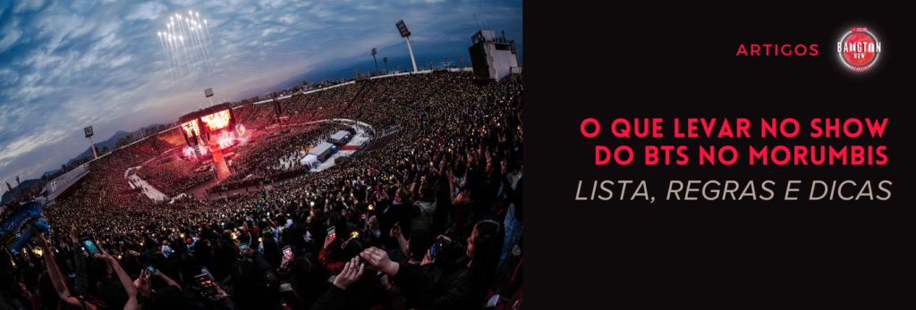 Estádio lotado no show do BTS em Santiago, no Chile, com fogos no céu ao entardecer, palco com telão ao fundo e fãs erguendo celulares e luzes douradas. Banner “O que levar no show do BTS no MorumBIS: lista, regras e dicas”, do Bangtan Now. Imagem: twitter BTSBigHit.